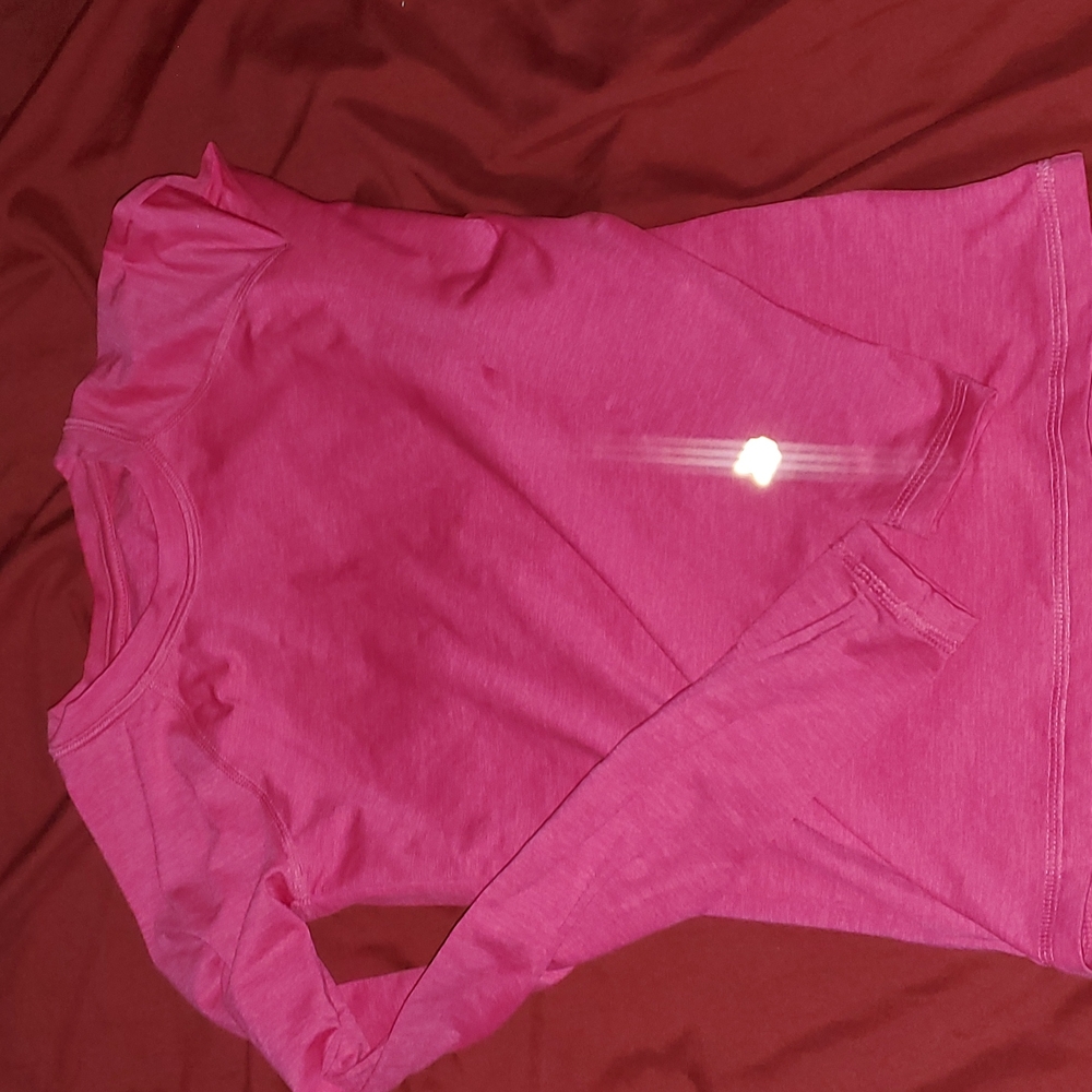 Girls sport shirt . Long sleeve.  Thumb slot on on both sleeves